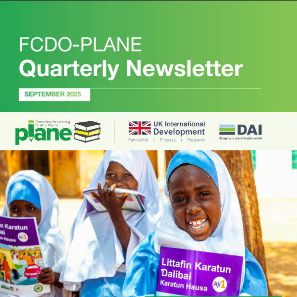 Learners holding a PLANE book